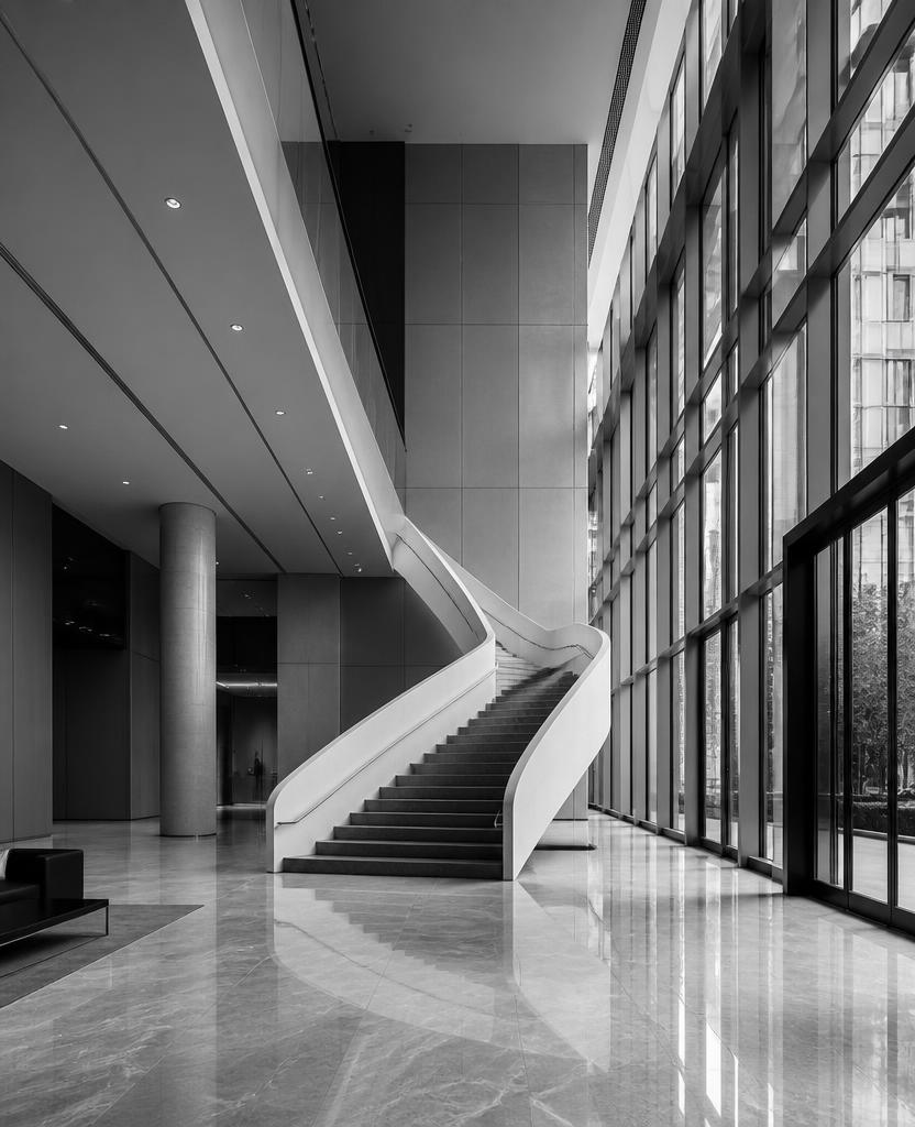 Lobby of the AisonLabs London office with a sculptural staircase